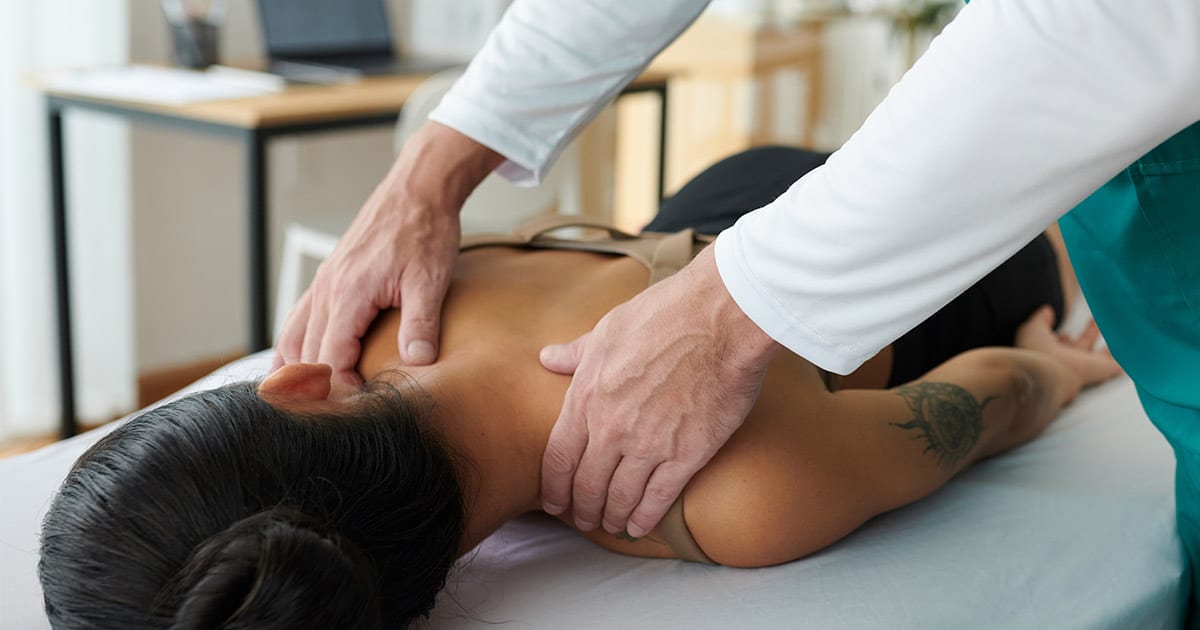 a person doing a back massage