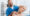 portrait of smiling chiropractor stretching neck
