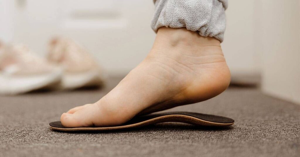 Foot in slipper on carpet, close-up of foot comfort and casual footwear.