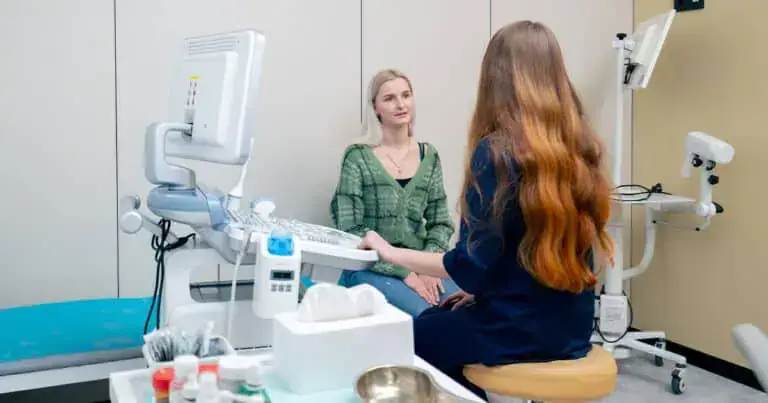 Medical professional conducting preventive health screening for a patient.